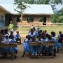 Children and parents in front of the school-building.
